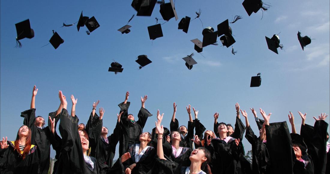 students celebrating better housing